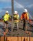 Concrete is placed in forms in the covered area at the temporary school, Dec. 29, 2023, in Lahaina, Hawaii.