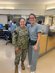 SAN DIEGO, Calif. (NOV. 21, 2023) Capt. Elizabeth Adriano (L), Naval Medical Center San Diego (NMCSD) director, poses with Ens. Sarah Martin, NMCSD Med-Surg nurse.  Adriano delivered Martin at NMCSD in 1999.  Coincidentally, Adriano also delivered Martin's brother at Naval Hospital Guam seven years later.  The mission of NMCSD is to prepare service members to deploy in support of operational forces, deliver high quality health care services, and shape the future of military medicine through education, training, and research. NMCSD employs more than 6,000 active-duty military personnel, civilians and contractors in southern California to provide patients with world-class care anytime, anywhere.