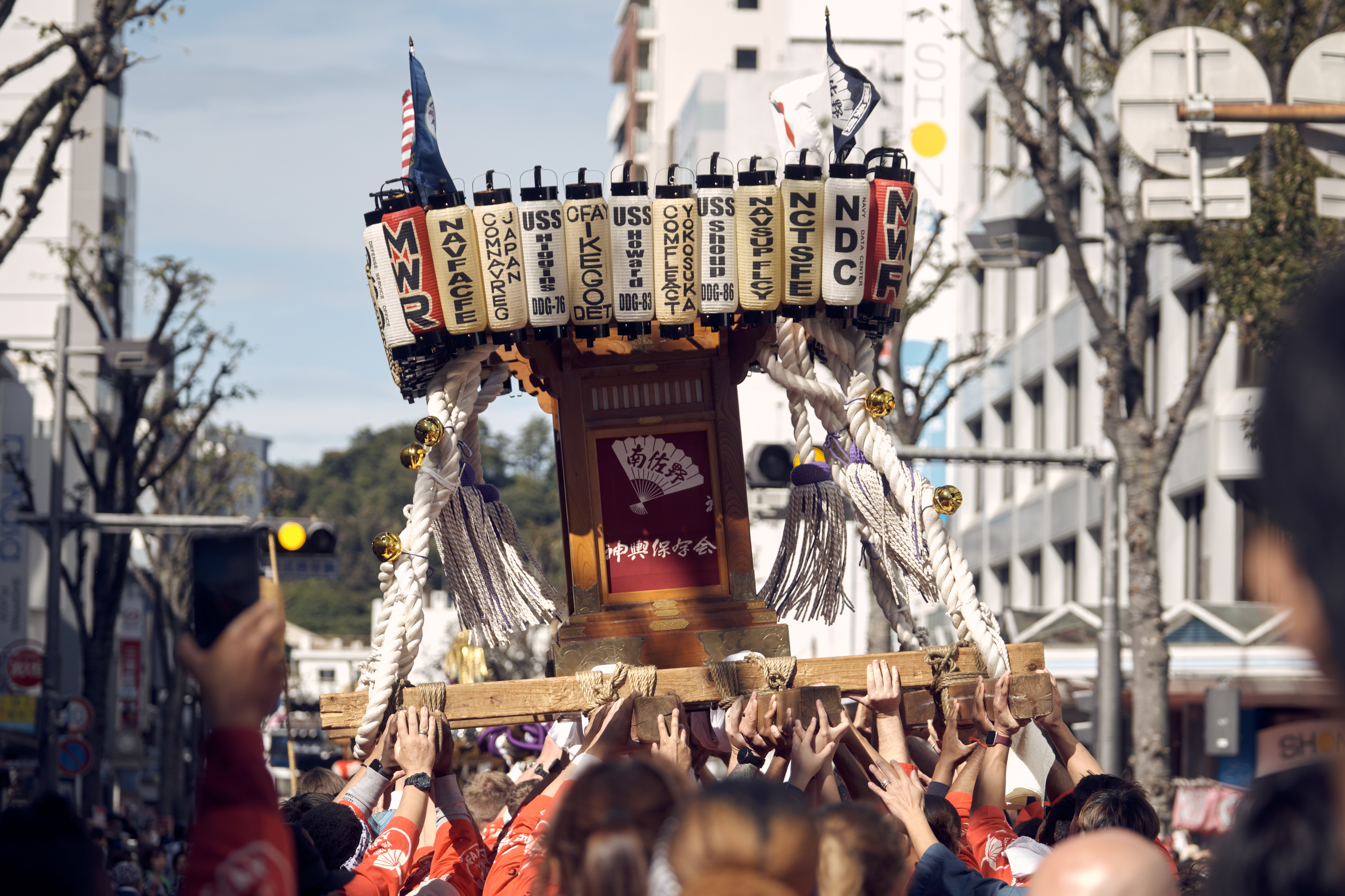 Commander, Fleet Activities Yokosuka's mikoshi, a customized and portable shrine, is carried by volunteers from the installation at the 44th Yokosuka Mikoshi Parade in Yokosuka, Japan.