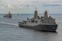 The San Antonio-class amphibious transport dock USS Mesa Verde (LPD 19), right, Harpers Ferry-class dock landing ship USS Carter Hall (LSD 50), left, and the Arleigh Burke-class guided-missile destroyer USS Bulkeley (DDG 84) sail in formation in the Mediterranean Sea, Dec. 31, 2023.  The U.S. maintains forward deployed, ready, and postured forces to deter aggression and support security and stability around the world. (U.S. Navy photo by Mass Communication Specialist 2nd Class Nolan Pennington)