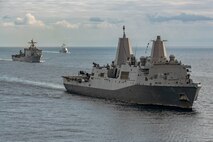 The San Antonio-class amphibious transport dock USS Mesa Verde (LPD 19), right, Harpers Ferry-class dock landing ship USS Carter Hall (LSD 50), left, and the Arleigh Burke-class guided-missile destroyer USS Bulkeley (DDG 84) sail in formation in the Mediterranean Sea, Dec. 31, 2023.  The U.S. maintains forward deployed, ready, and postured forces to deter aggression and support security and stability around the world. (U.S. Navy photo by Mass Communication Specialist 2nd Class Nolan Pennington)