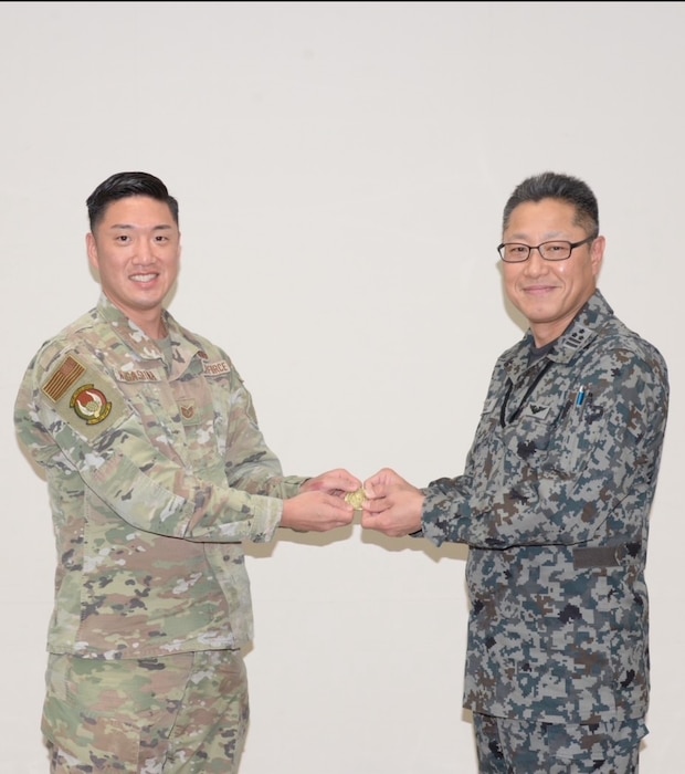 Japanese LEAP Scholar Tech. Sgt. Joshiro Nagashima (Left) received recognition from the Japanese Air Self Defense Force’s Operation Support Wing Commander for providing English classes to the JASDF Airmen and Master Labor Contractors. (Courtesy Photo)