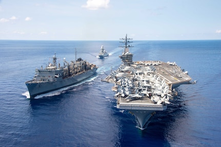 The Nimitz-class aircraft carrier USS Dwight D. Eisenhower (CVN 69), the Carlo Bergamini-class frigate ITS Virginio Fasan (F 591) and the Supply-class fast combat support ship USNS Supply (T-AOE 6) steam in formation while completing a replenishment-at-sea July 3, 2023.