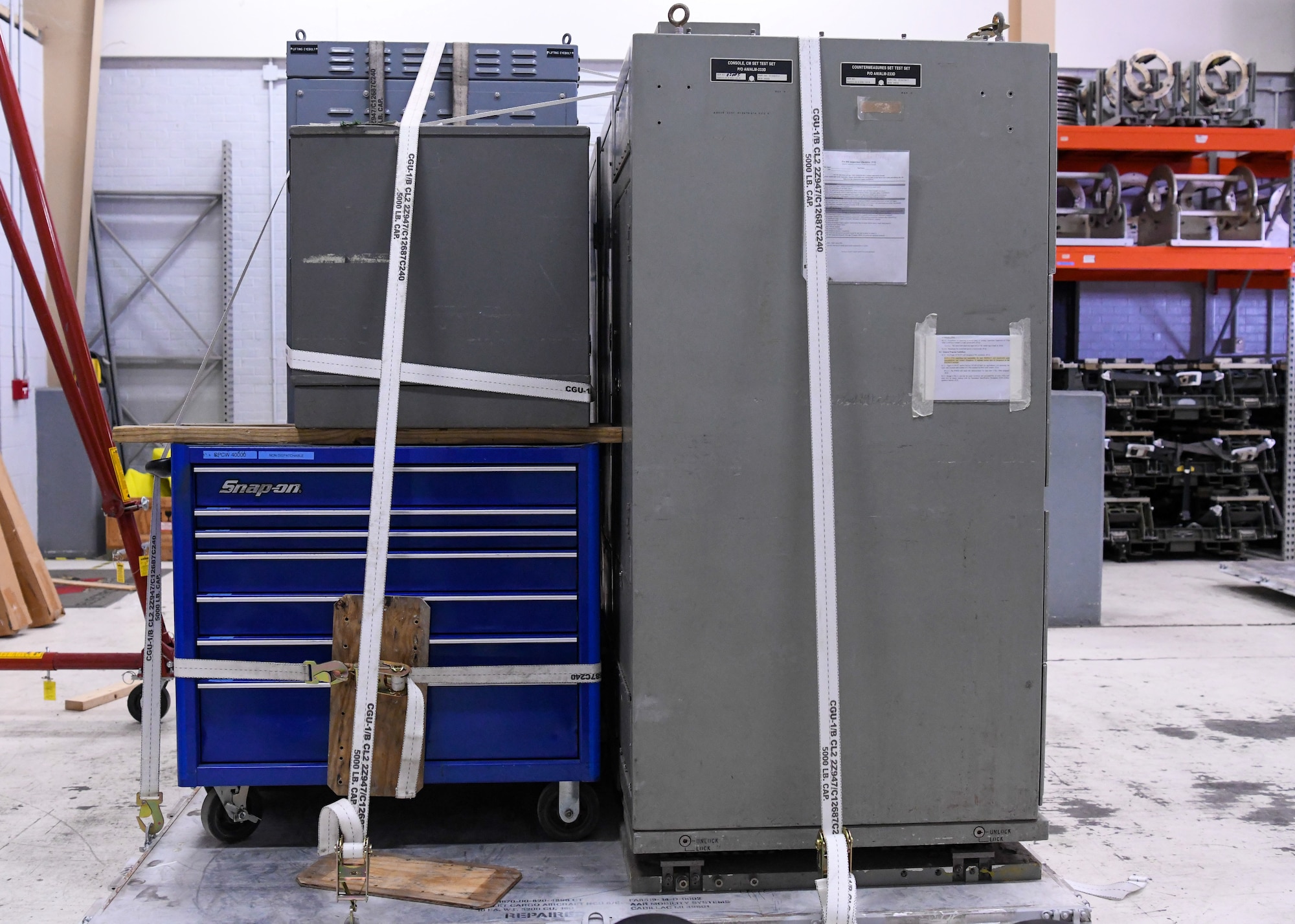 A tool chest and storage cabinets sit on a pallet.