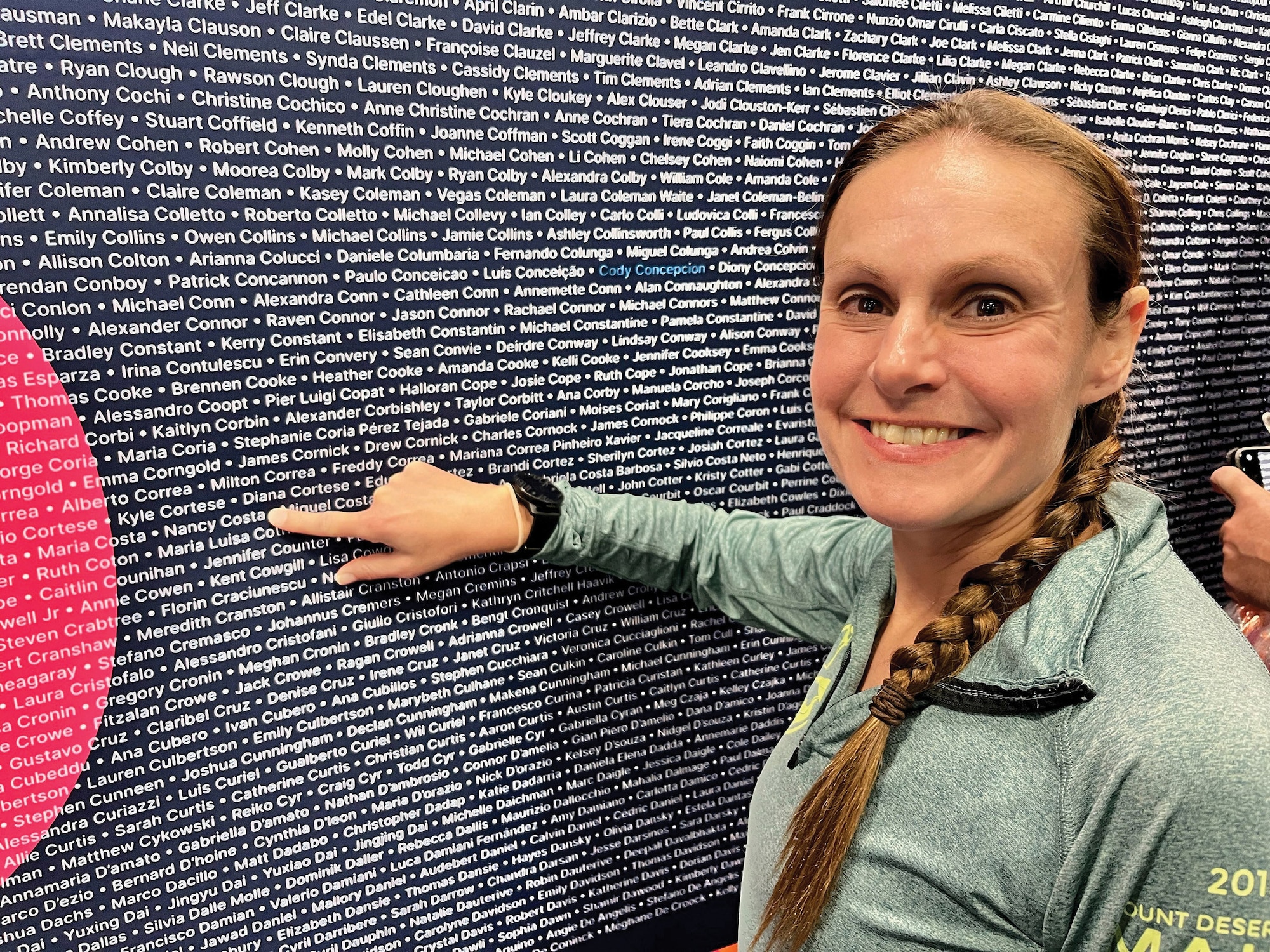 Maj. Nancy Costa 445th Medical Service Flight officer in-charge, points to her name on the wall of race participants in the New York City Marathon, Nov. 5th, 2023. Costa finished the marathon with a time of 3:28:28 which is a 7:58 mile pace. Since its inception in 1970, the NYC Marathon has attracted premiere athletes, professional and recreational runners. Over 50,000 runners finished this year’s race Nov. 5, 2023, including two other Airmen from the 445th ASTS; Capt. Daniel Shields and Capt. Megan Busellato.