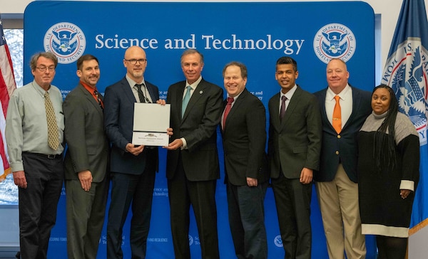 Left to Right: Pete Devlin, Dept. of Energy; Nick Josefik, USACE ERDC CERL; Ronald Langhelm, DHS S&T; Dr. Dimitri Kusnezov, Under Secretary of DHS Science and Technology Directorate (S&T); Zachary Kittrie, FEMA; Prateek Vaish, Accelera by Cummins; Chris Steinhilber, Support Contractor - DHS S&T; Kathryn Grazionale, Support Contractor - DHS S&T.