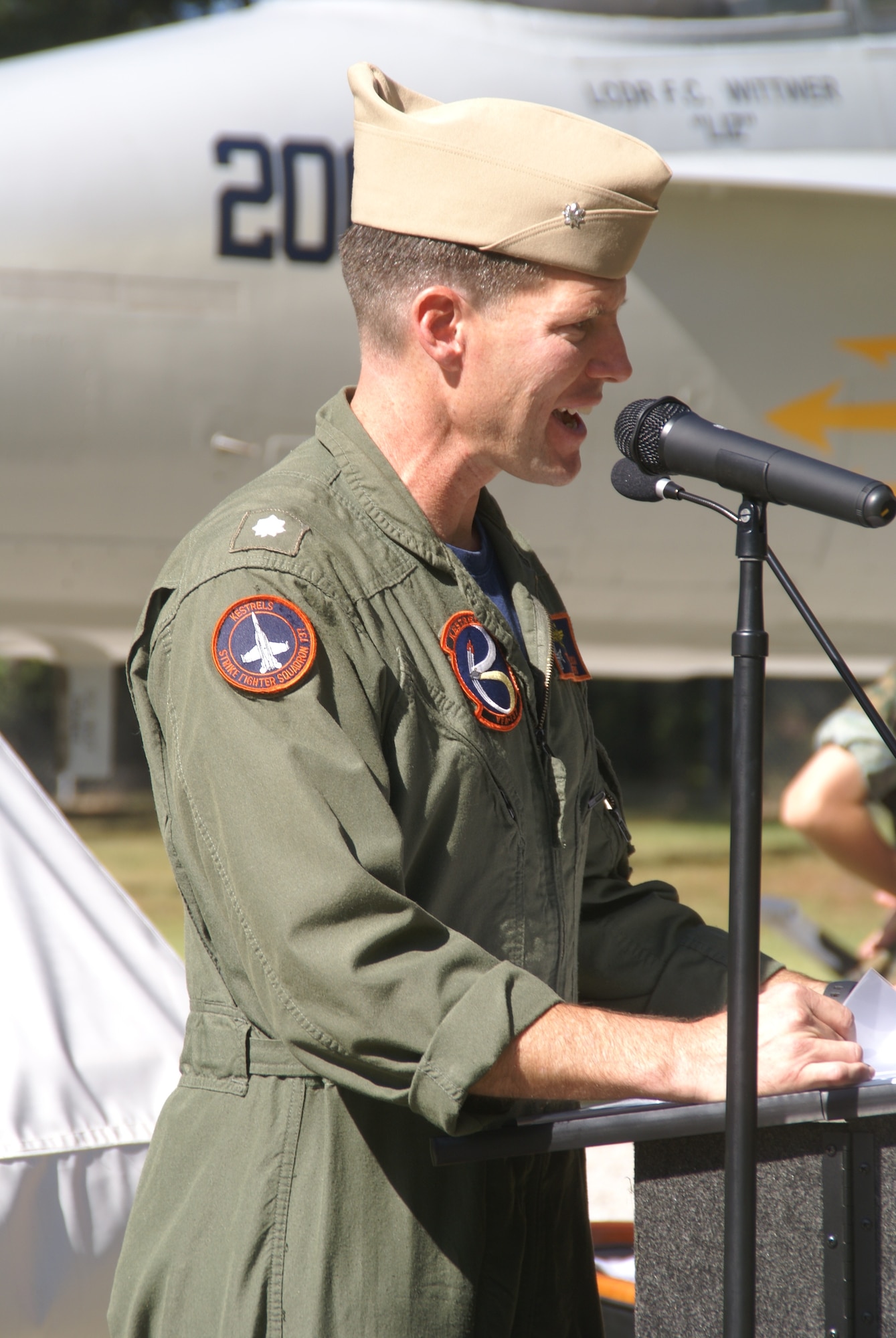 Navy Cmdr. Todd Wilson, then-commanding officer of VFA-137 at Naval Air Station Lemoore in California, speaks during the Oct. 3, 2009, ceremony to dedicate the F/A-18 Hornet static display at Arnold Air Force Base, Tenn., in honor of Navy Lt. Cmdr. Frank Wittwer. Wittwer died Jan. 18, 2006, in a crash caused by aircraft mechanical failure during a nighttime training mission over California. He was preparing for deployment overseas. Wittwer was a 1994 graduate of the U.S. Naval Academy. (U.S. Air Force photo by Philip Lorenz III)