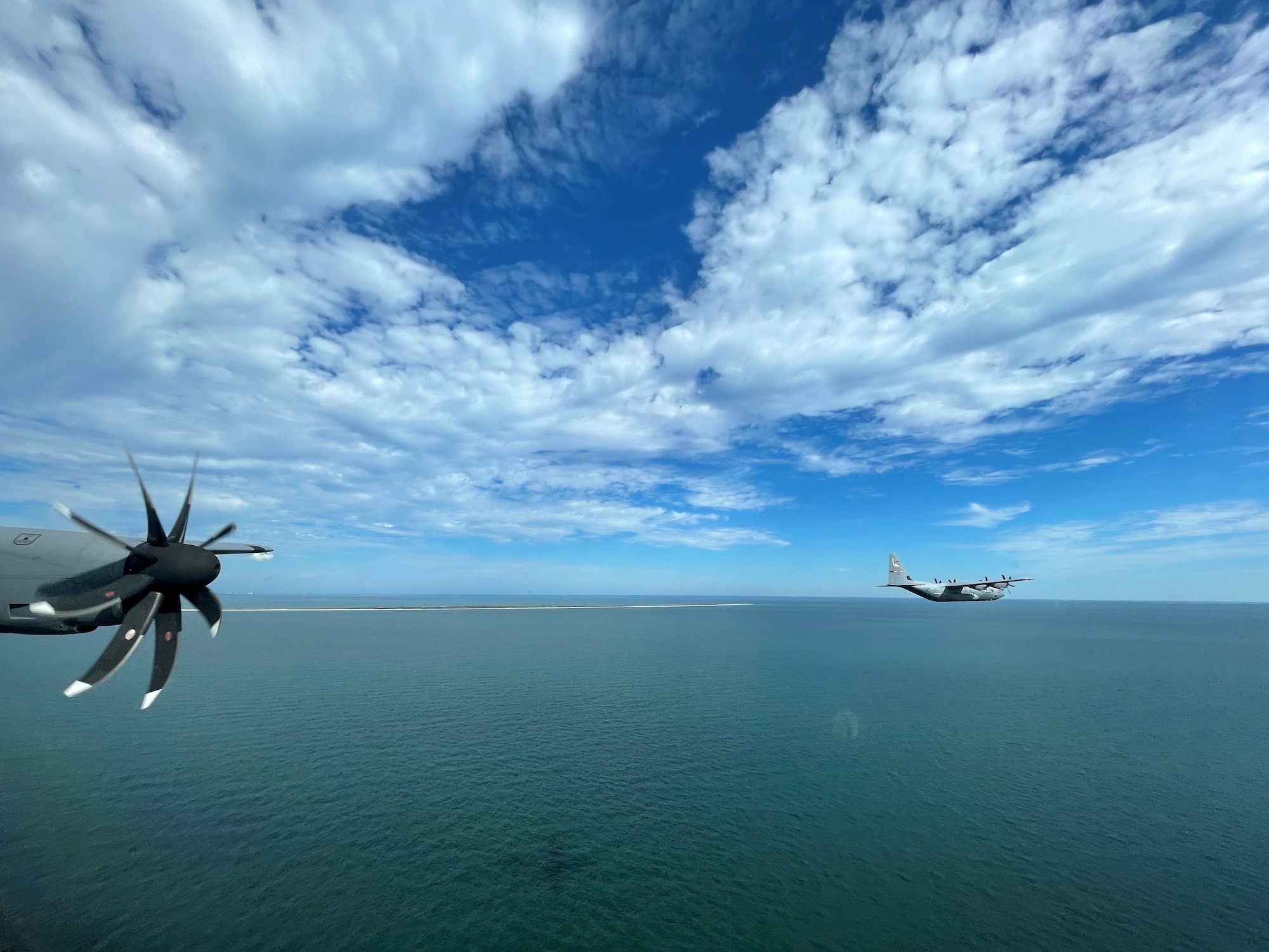 an airplane flies over water