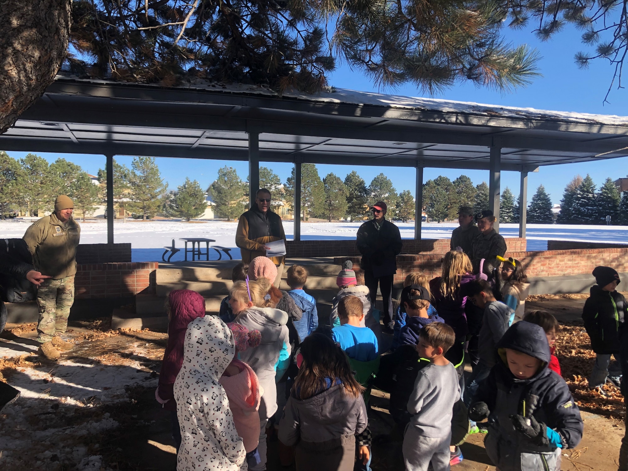 Members of Space Base Delta 1, 21st Civil Engineer Squadron and the R.P Lee Youth center listen to Bob Tomlinson, 21st CES environmental chief, read the Official Arbor Day Proclamation at the start of the Arbor Day ceremony on Peterson Space Force Base, Colorado, October 30, 2023. Arbor Day dates back to April 10,1872, when an estimated 1 million trees were planted in the state of Nebraska. (U.S. Space Force photo by Natural Resources Manager David Kelley)