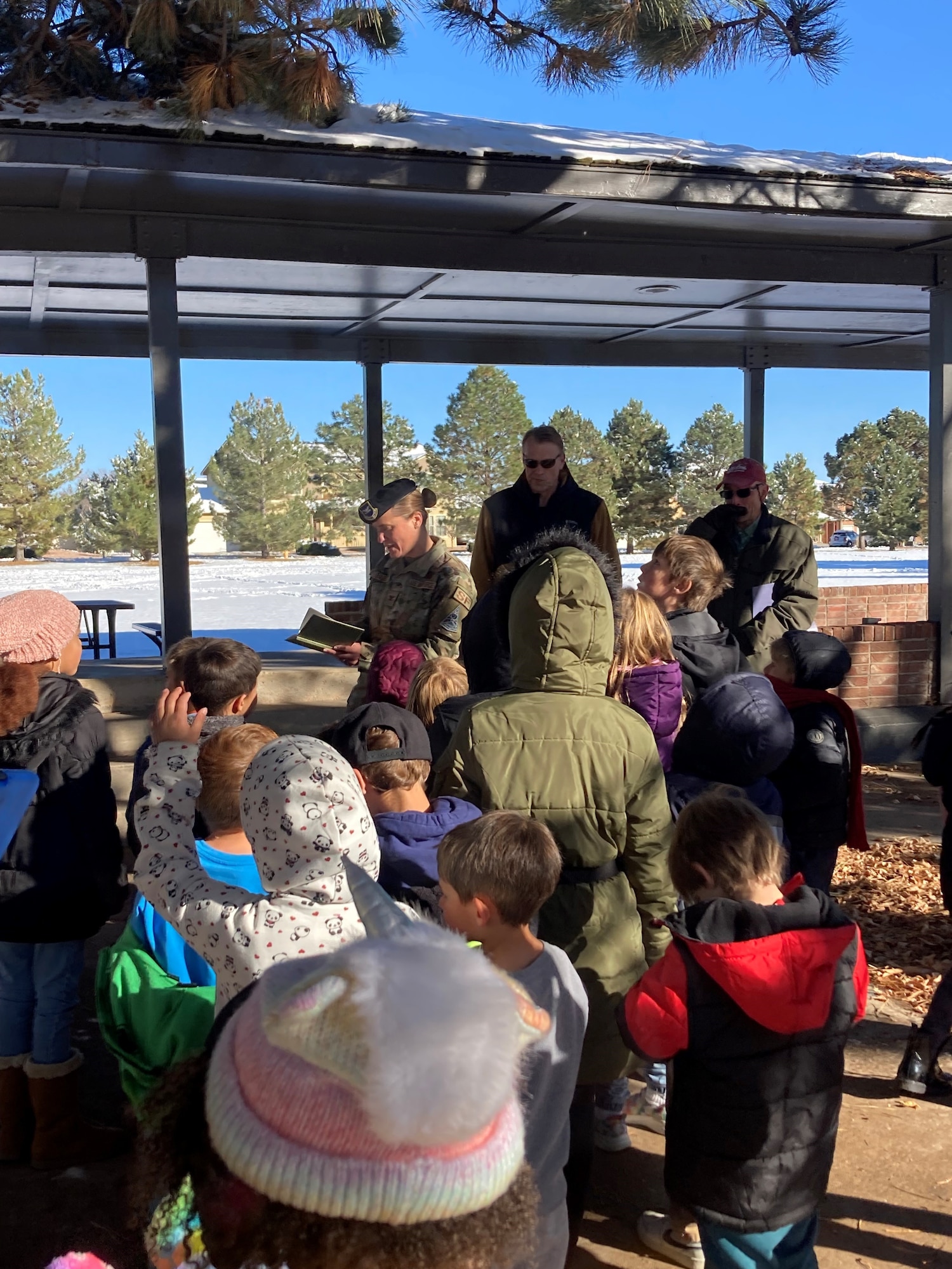U.S. Air Force Col. Sarah S. Babbitt, Space Base Delta 1 vice commander, center, reads from “The Giving Tree” to children from R.P. Lee Youth Center during the annual Arbor Day ceremony on Peterson Space Force Base, Colorado, October 30, 2023. Arbor Day dates back to April 10,1872, when an estimated 1 million trees were planted in the state of Nebraska. (U.S. Space Force photo by Natural Resources Manager David Kelley)
