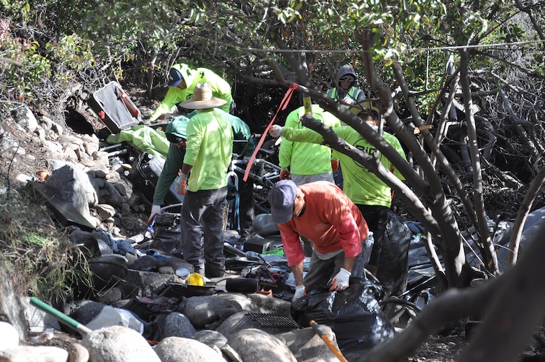 Workers contracted by the U.S. Army Corps of Engineers Los Angeles District remove trash and debris from the riverbed of the San Gabriel River Dec. 4 near Azusa, California. The cleanup took place over a three-week period after bird-nesting season ended.