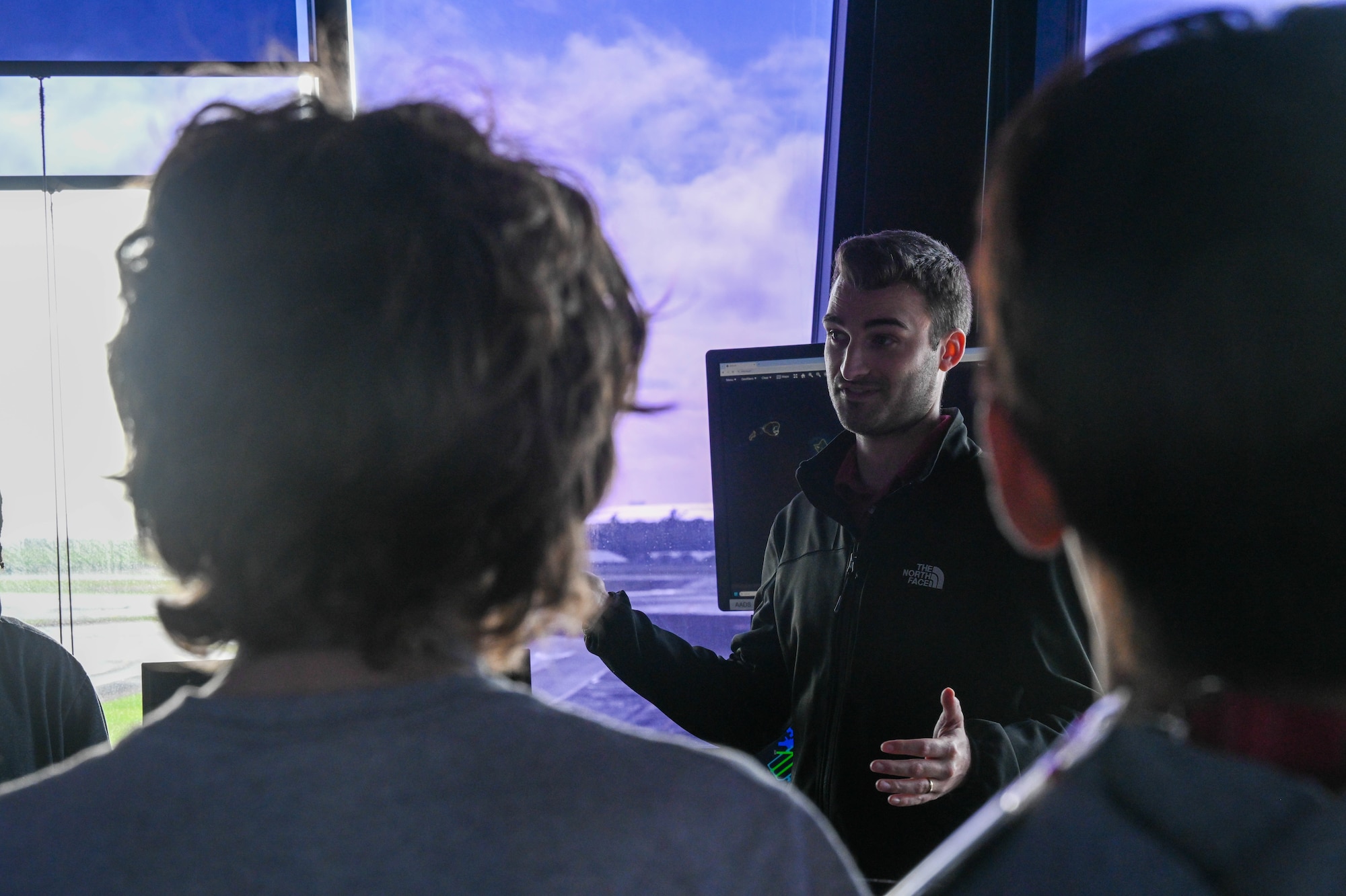 Airman speaks to students.