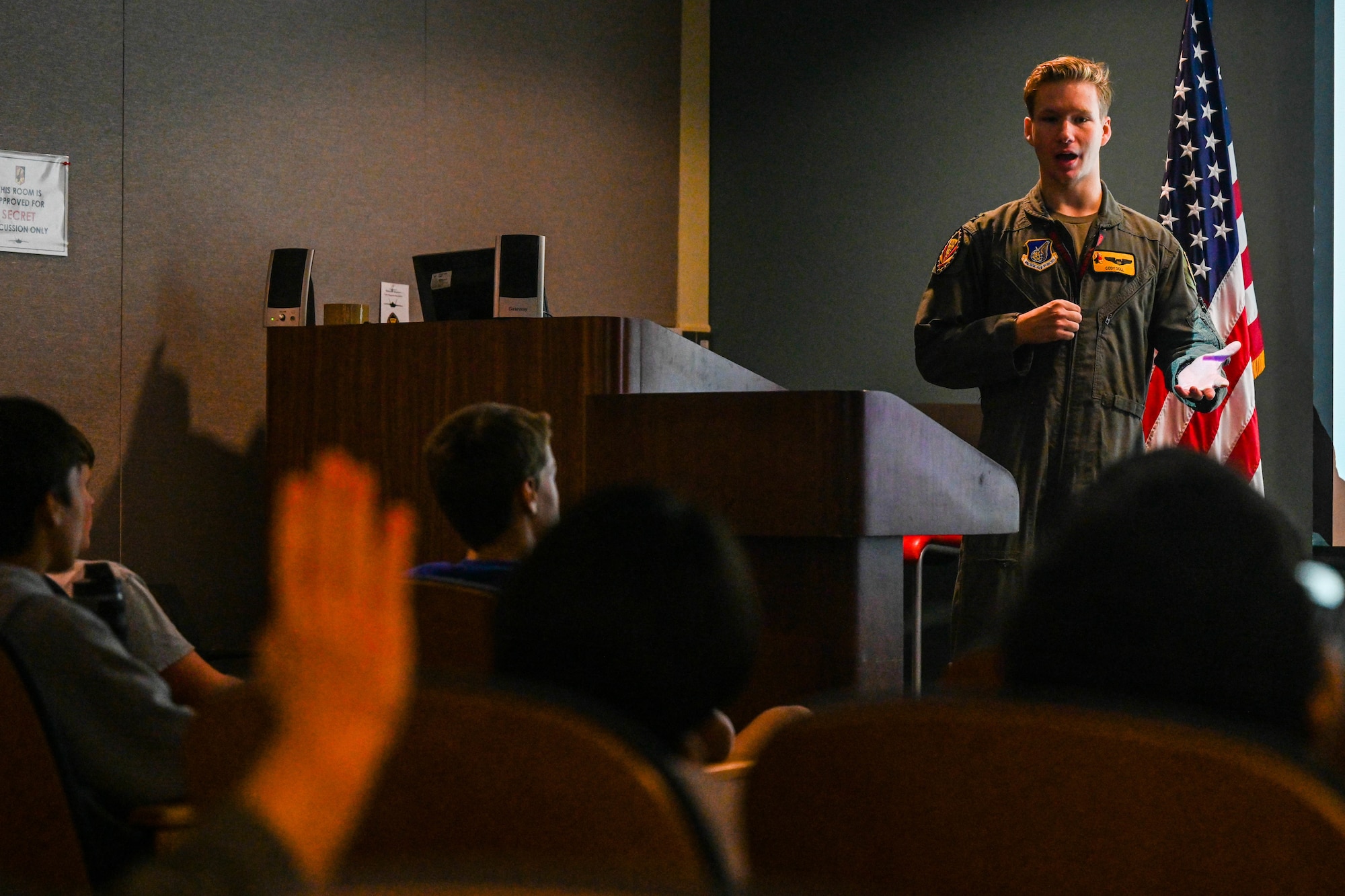Airman speaks to students.