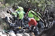 Workers contracted by the U.S. Army Corps of Engineers Los Angeles District remove trash and debris from the riverbed of the San Gabriel River Dec. 4 near Azusa, California. The cleanup took place over a three-week period after bird-nesting season ended.