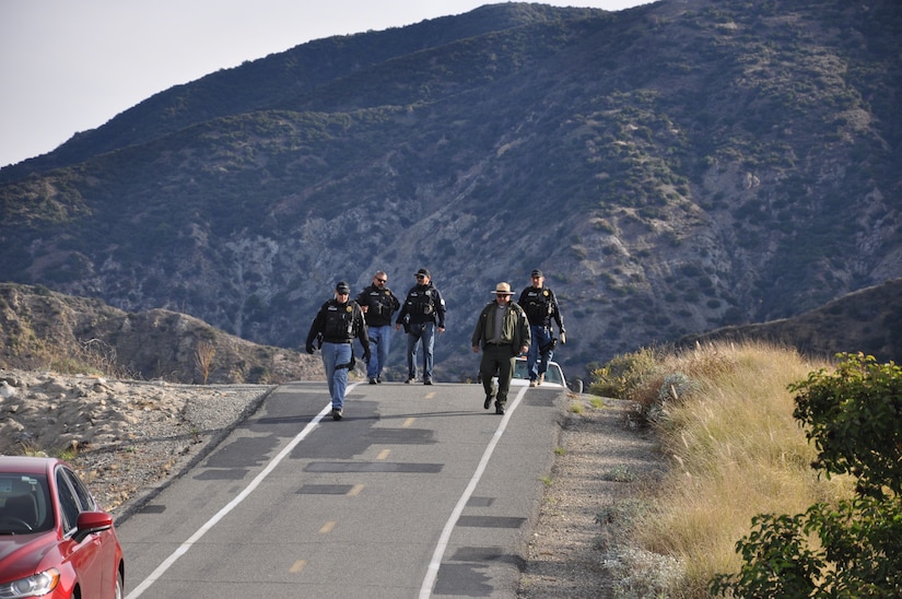 A group that includes contractors, law enforcement personnel and members of the U.S. Army Corps of Engineers Los Angeles District gather Dec. 4 to embark on a three-week project to clear encampments and debris in and around the San Gabriel River near Azusa, California.