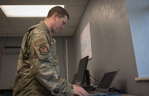 Airmen working computer
