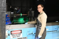 U.S. Air Force Airman 1st Class Kellie Marshall, a traditional Guardsman with the 173rd Fighter Wing, prepares to conduct a magnetic particle inspection Dec. 15, 2023, at Kingsley Field in Klamath Falls, Oregon. The inspection finds cracks in material preventing potential part failure and aircraft mishaps.