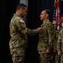 Sergeant Major of the Army in uniform promotes male Soldier