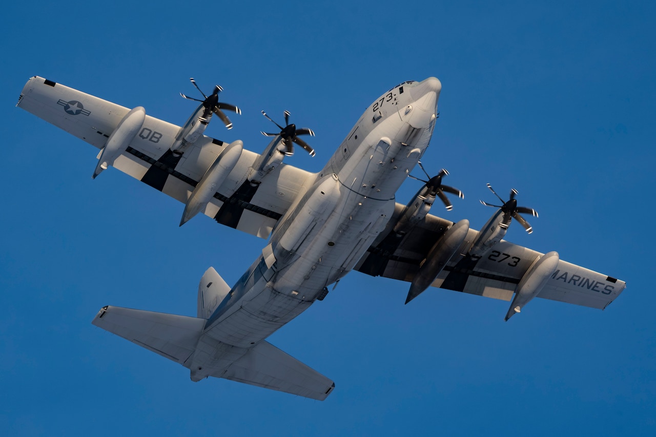 An aircraft flies as seen from below.