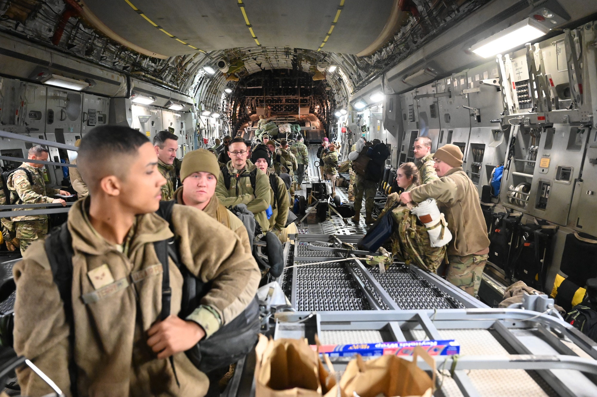 Reserve Citizen Airmen with the 445th Airlift Wing wait to disembark from a wing C-17 Globemaster III aircraft at Wright-Patterson Air Force Base, Ohio, Jan. 4, 2024. The aircraft, crew and passengers returned from a two-month deployment where they transported cargo, personnel and humanitarian aid to various locations. (U.S. Air Force photo by Master Sgt. Patrick O’Reilly)