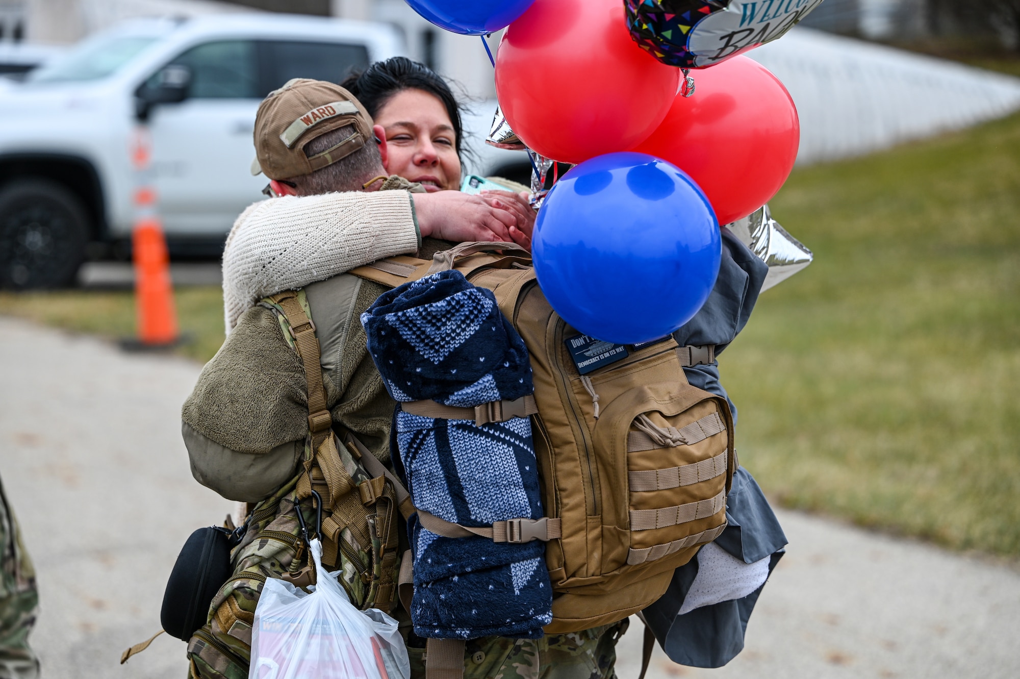 A Reserve Citizen Airmen with the 445th Airlift Wing reunites with a family member at Wright-Patterson Air Force Base, Ohio, Jan. 4, 2024. The Airmen returned from a two-month deployment where they transported cargo, personnel and humanitarian aid to various locations. (U.S. Air Force photo by Master Sgt. Patrick O’Reilly)