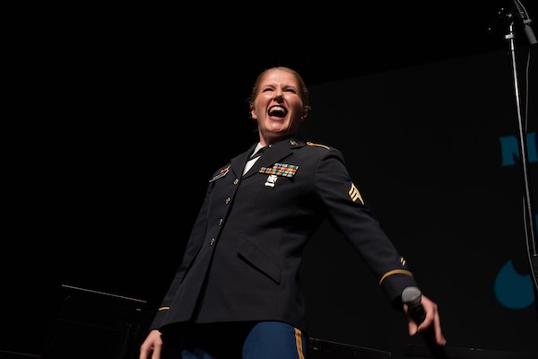 U.S. Army North 323d Army Band vocalist continues her service as she shares her talents by singing the National Anthem at a football game in Seattle, Wa. on Dec 1, 2023.