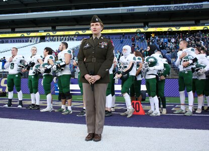 U.S. Army North 323d Army Band vocalist continues her service as she shares her talents by singing the National Anthem at a football game in Seattle, Wa. on Dec 1, 2023.