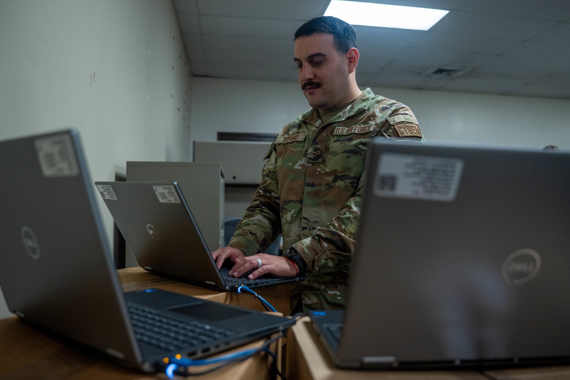 Airman works on computer.