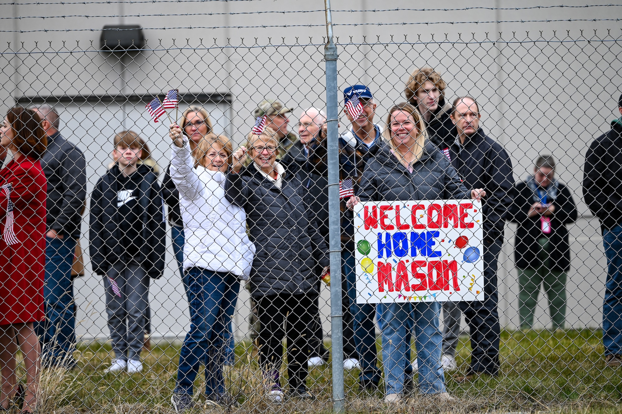 Family and friends wait to welcome home 445th Airlift Wing Reserve Citizen Airmen at Wright-Patterson Air Force Base, Ohio, Jan. 4, 2024. The Airmen returned from a two-month deployment where they transported cargo, personnel and humanitarian aid to various locations. (U.S. Air Force photo by Master Sgt. Patrick O’Reilly)