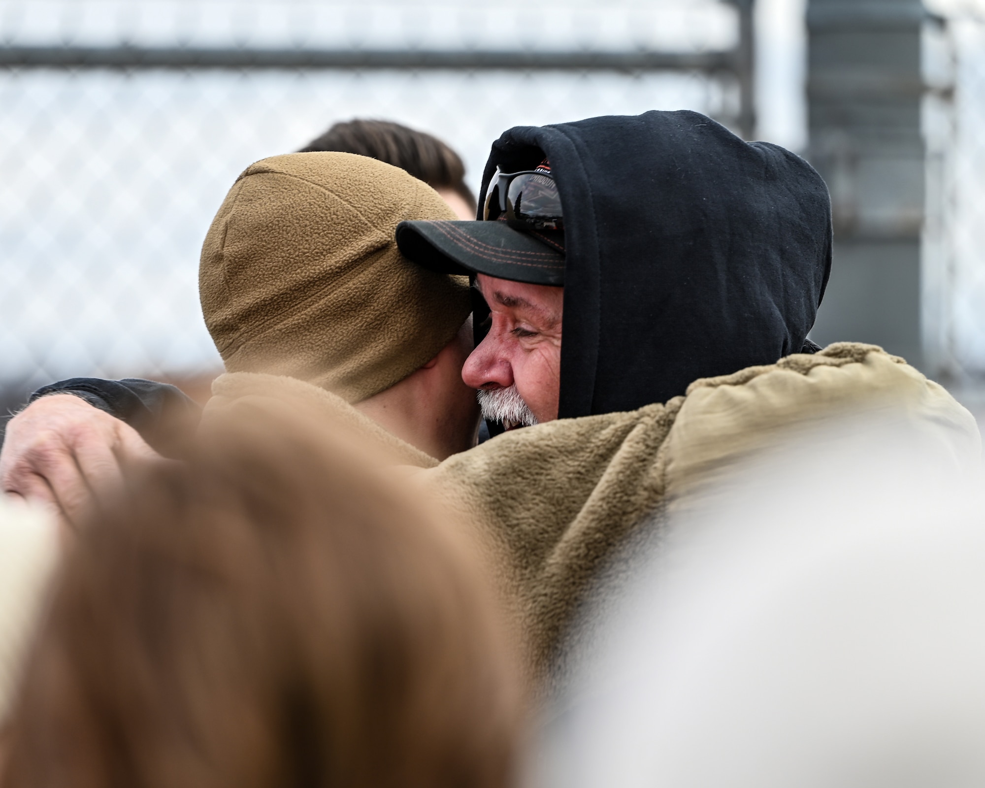 A Reserve Citizen Airmen with the 445th Airlift Wing reunites with a family member at Wright-Patterson Air Force Base, Ohio, Jan. 4, 2024. The Airmen returned from a two-month deployment where they transported cargo, personnel and humanitarian aid to various locations. (U.S. Air Force photo by Master Sgt. Patrick O’Reilly)