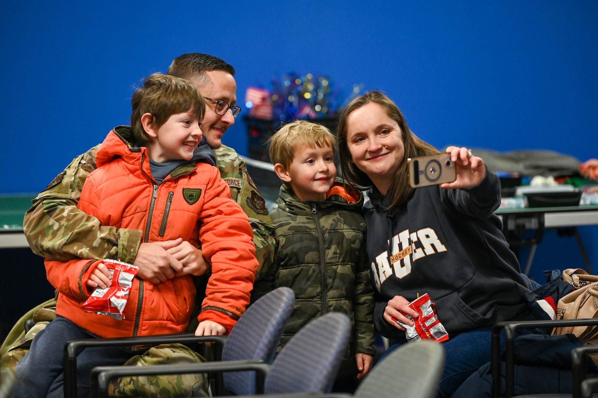 A Reserve Citizen Airmen with the 445th Airlift Wing reunites with family members at Wright-Patterson Air Force Base, Ohio, Jan. 4, 2024. The Airmen returned from a two-month deployment where they transported cargo, personnel and humanitarian aid to various locations. (U.S. Air Force photo by Master Sgt. Patrick O’Reilly)