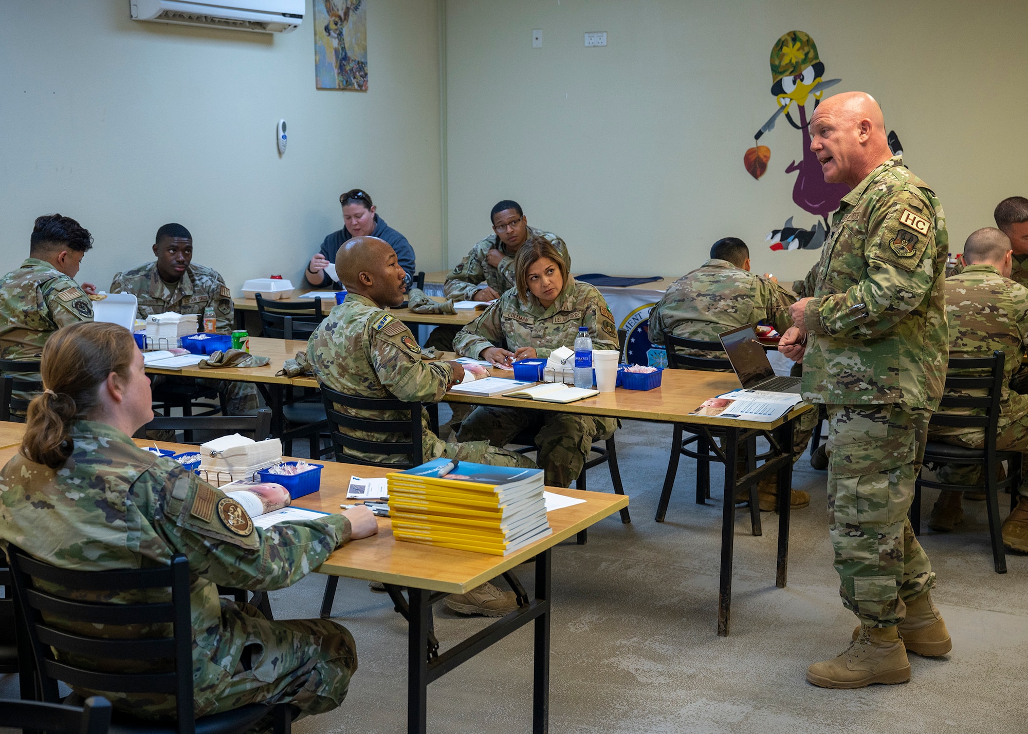 A man instructs students.