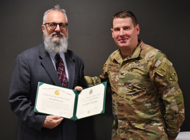Col. Ronald Sturgeon, U.S. Army Corps of Engineers, Savannah District commander, presented Matthew Delano, Geotechnical and Hazardous, Toxic, Radioactive Waste branch chief, with a Certificate of Retirement and a Department of the Army Meritorious Civilian Service Medal after 43 years of federal service during his retirement ceremony, Jan. 3, 2024. Family and teammates gathered to celebrate Delano’s accomplishments and share kind words about the impact he has had on the people, culture and mission of the branch.