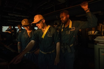 Sailors stand watch aboard USS Laboon (DDG 58) as the ship transits the Bab Al-Mandeb Strait.