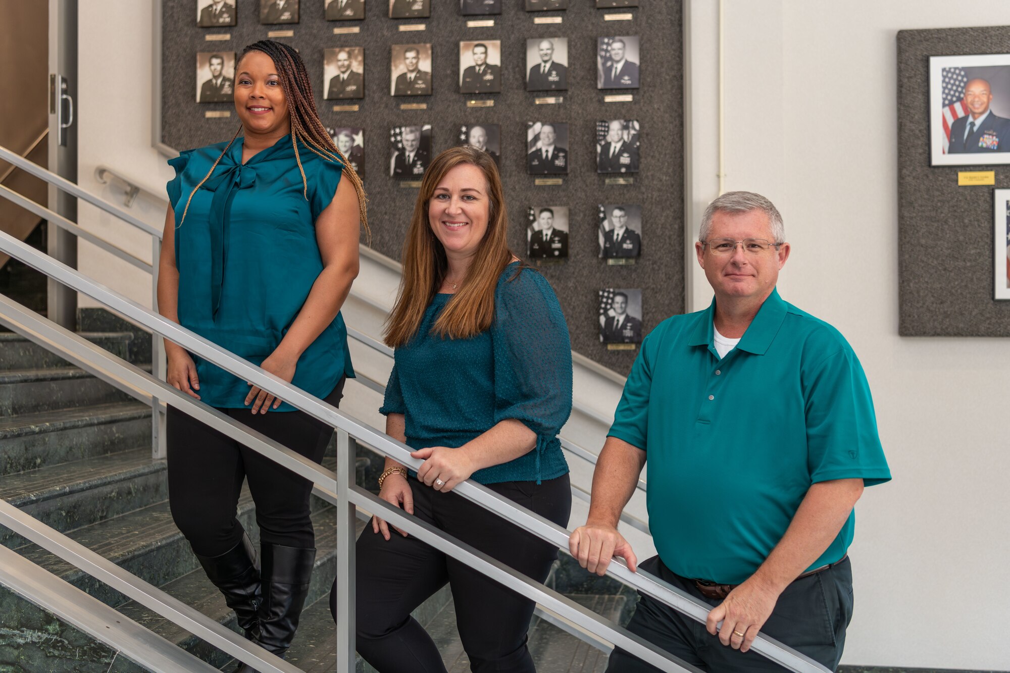 The staff of the Arnold Air Force Base Sexual Assault Prevention Response program office gather for a photo Dec. 5, 2023, in the Administration & Engineering Building at Arnold AFB, Tenn. Pictured from left are Sexual Assault Victim Advocate Kayla Vance, Sexual Assault Victim Advocate Nicole Berger and Sexual Assault Response Coordinator Gary Johnson. The office has been established to provide victims of sexual assault and sexual harassment with resources and information, present them with available investigatory reporting options, and guide them through any processes that result from their chosen course of action. (U.S. Air Force photo by Keith Thornburgh)