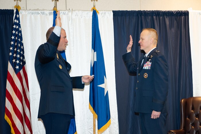 Bibb administers the oath of office to Salmi.