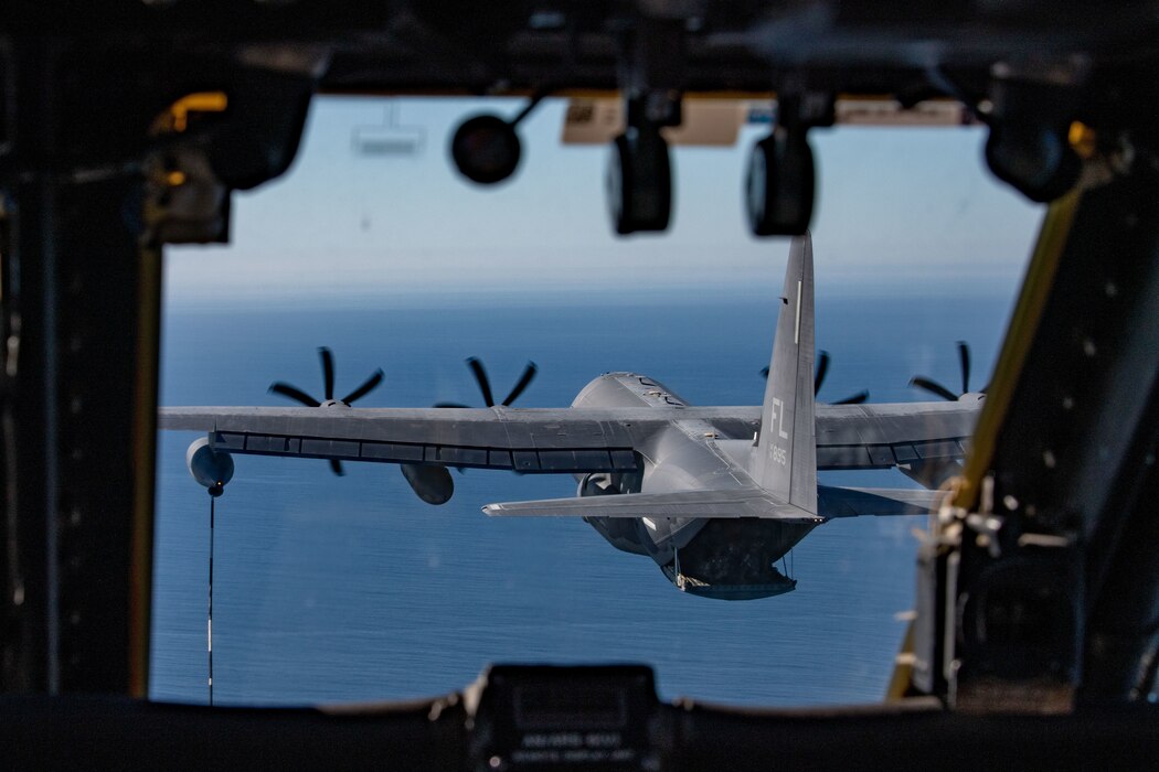 A 920th Rescue Wing HH-60G Pave Hawk prepares to connect to the hose-and-drogue system of an HC-130J Combat King II