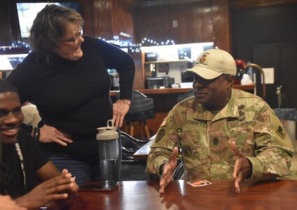 Command Sgt. Maj. Linwood Barrett Jr talks with Soldiers during Holiday Block Leave at Fort Eisenhower, Ga. These Soldiers opted to stay on post through the holidays and leadership spent many days getting to know them better.