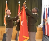 Brig. Gen. Howard was promoted to his current rank in a ceremony at the Eisenhower Conference and Catering center on Fort Eisenhower January 5, 2024. Unfurling the one-star flag is newly promoted Brig. Gen. Howard and Command Sergeant Major Linwood Barrett Jr.