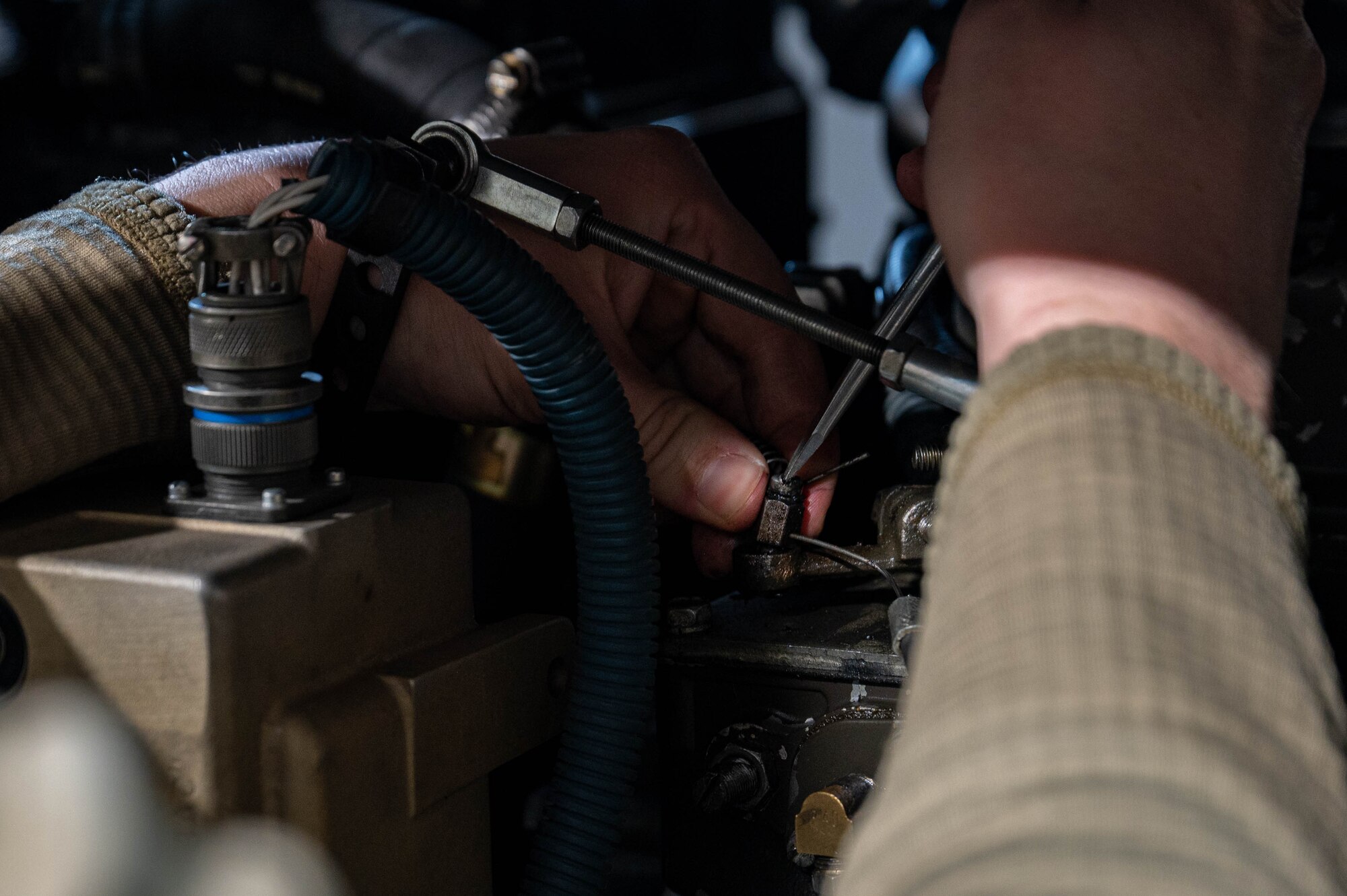 An Airman working on a power generator
