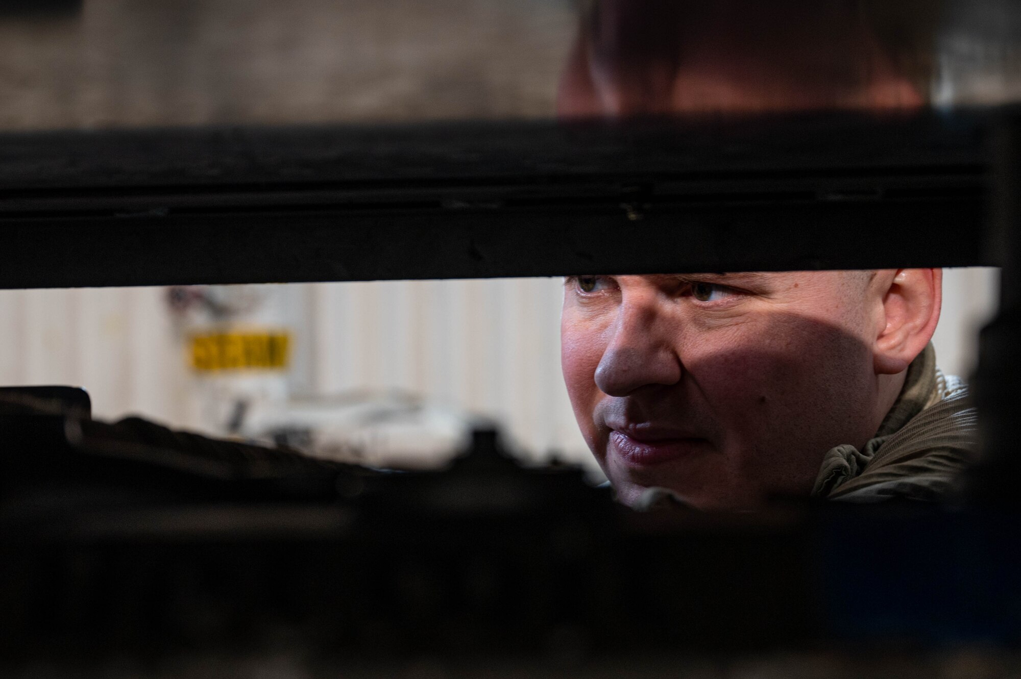 An Airman working on a power generator