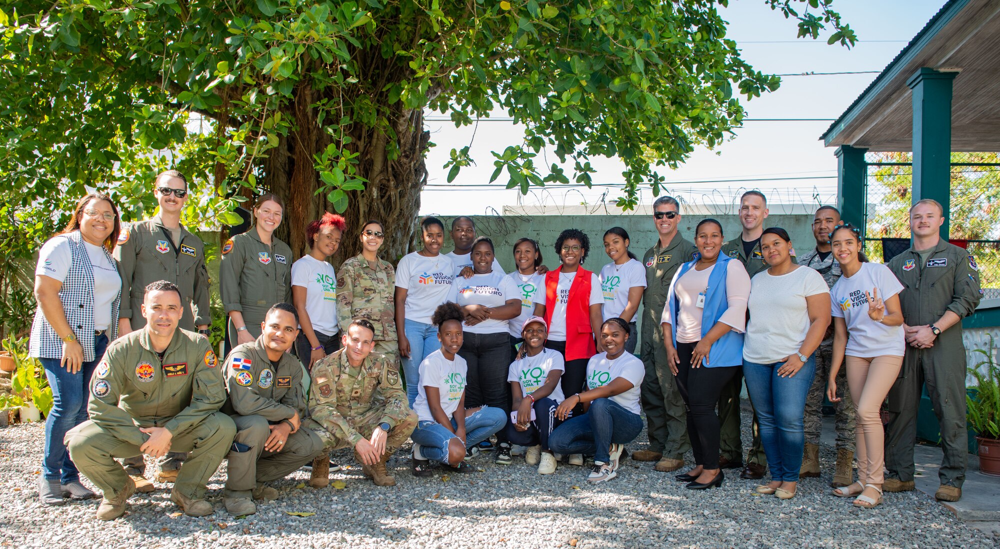 Members from the U.S. Air Force, Fuerza Aérea de Republica Dominicana (FARD) and Boca Chica Youth Network pose for a group photo at the La Casona community center, Dominican Republic, Feb. 21, 2023. The network was established in 2021 as part of a social investment to empower youth in designing and implementing actions to promote youth development within the community. Service members exchanged experiences about their profession and how life skillsplay an important role in career success. (U.S. Air Force photo by Tech. Sgt. Jessica H. Smith-McMahan)