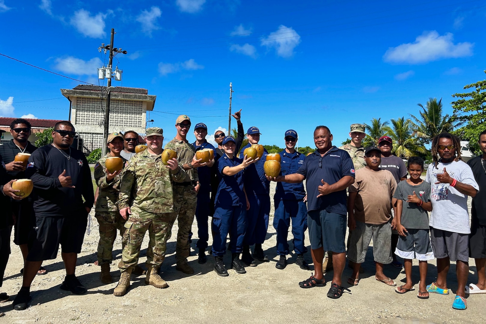 U.S. Coast Guard and U.S. Navy members stand for a photo with community members in the Republic of Palau following a boating safety class on Dec. 28, 2023. The U.S. Coast Guard regularly works with partners in the Republic of Palau; this series of events was part of Pacific Partnership 2024, which is now, in its 19th iteration, the largest multinational humanitarian assistance and disaster relief preparedness mission conducted in the region. (U.S. Coast Guard photo)