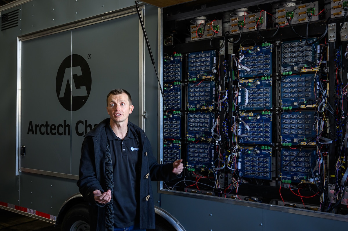 Gleason speaks shows off the internal components of the mobile battery management system.