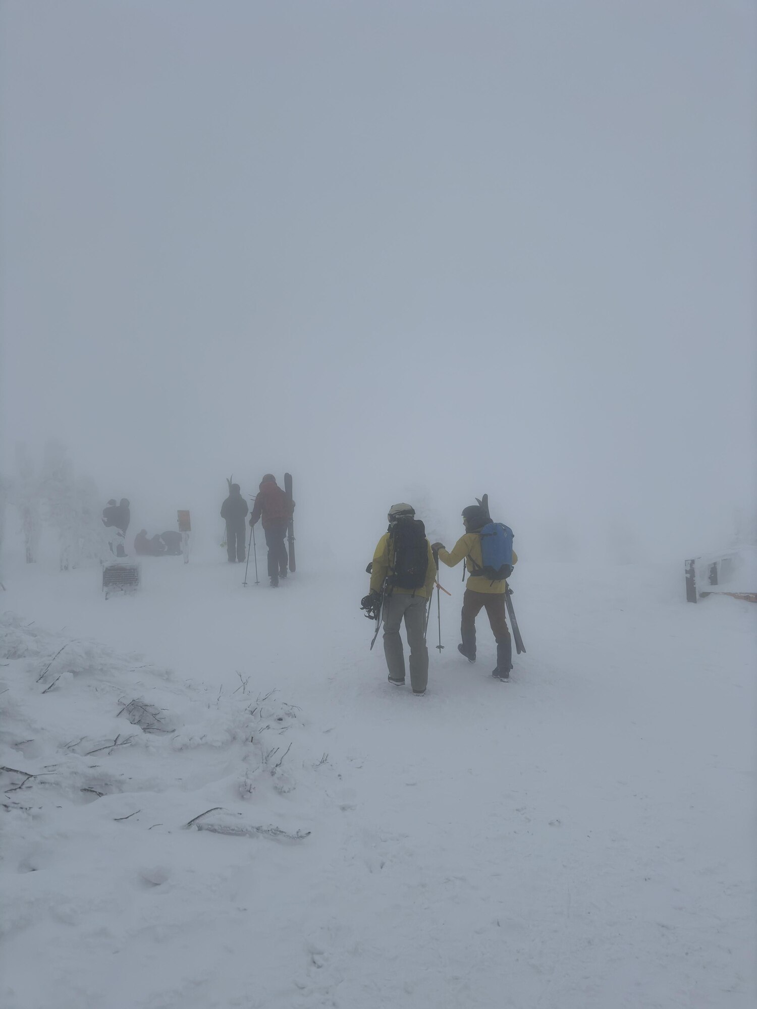 Participants of a search and rescue team move down the mountain during a snow storm after finding the missing member at Hakkoda Range, Japan, Dec. 29, 2023.