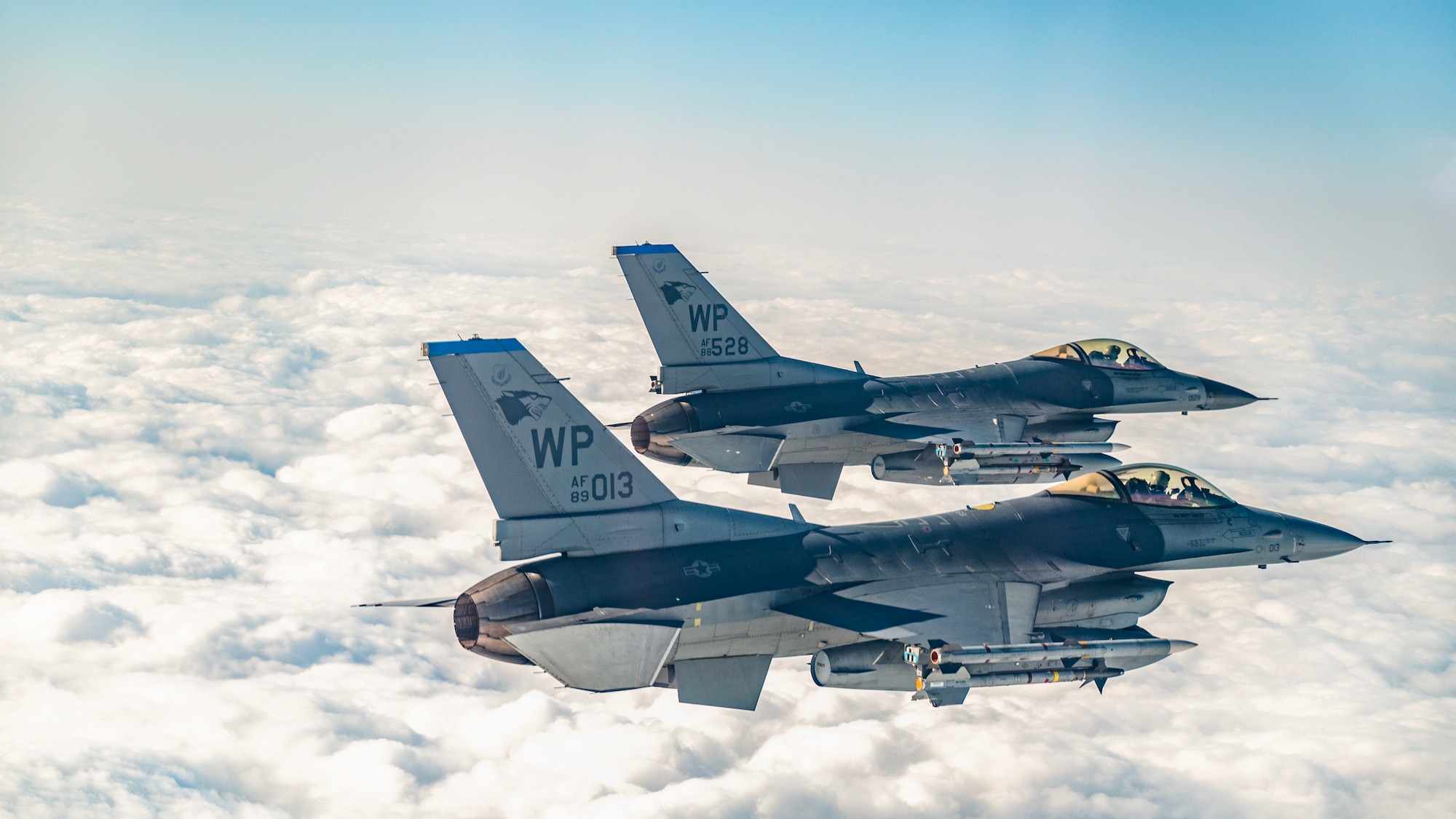 Two U.S. Air Force F-16 Fighting Falcons assigned to the 35th Fighter Squadron, soar over the Indo-Pacific