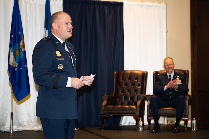 Bibb addresses audience during ceremony.