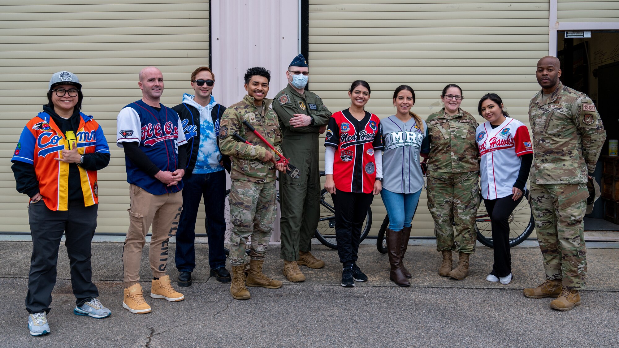 The Kunsan Quality of Life Task Force stand a photo after a bike exchange event.