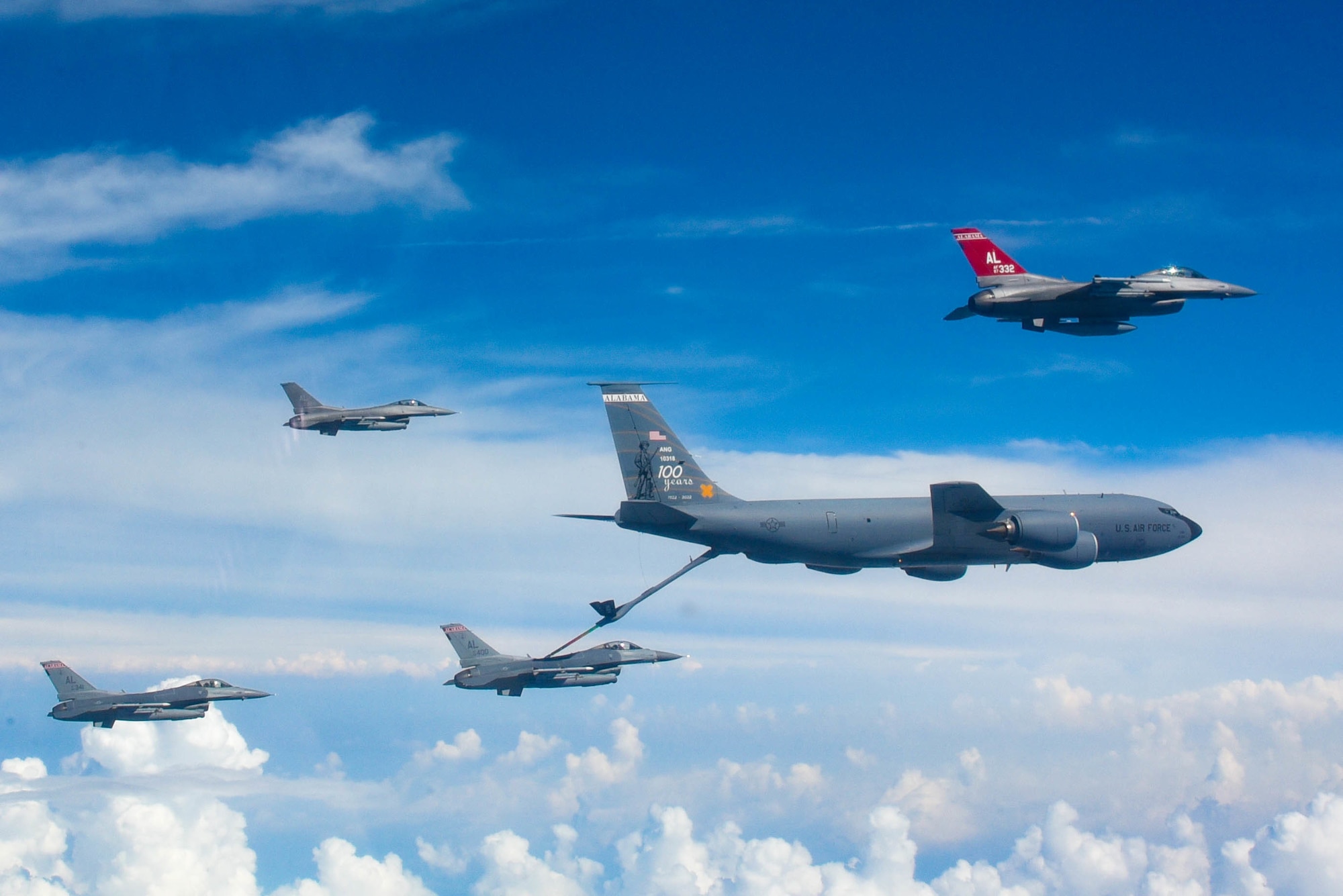 U.S. Air Force F-16C Falcons from the 187th Fighter Wing, Montgomery, Alabama, are refueled by a KC-135R Stratotanker from the 117th Air Refueling Wing, Birmingham,  Alabama, Aug. 17, 2022. Photo was taken with the Red Tails and the 100th anniversary commemorative tail for the 117th Air Refueling Wing. (U.S. Air National Guard photo by Senior Airman Nicholas Faddis)