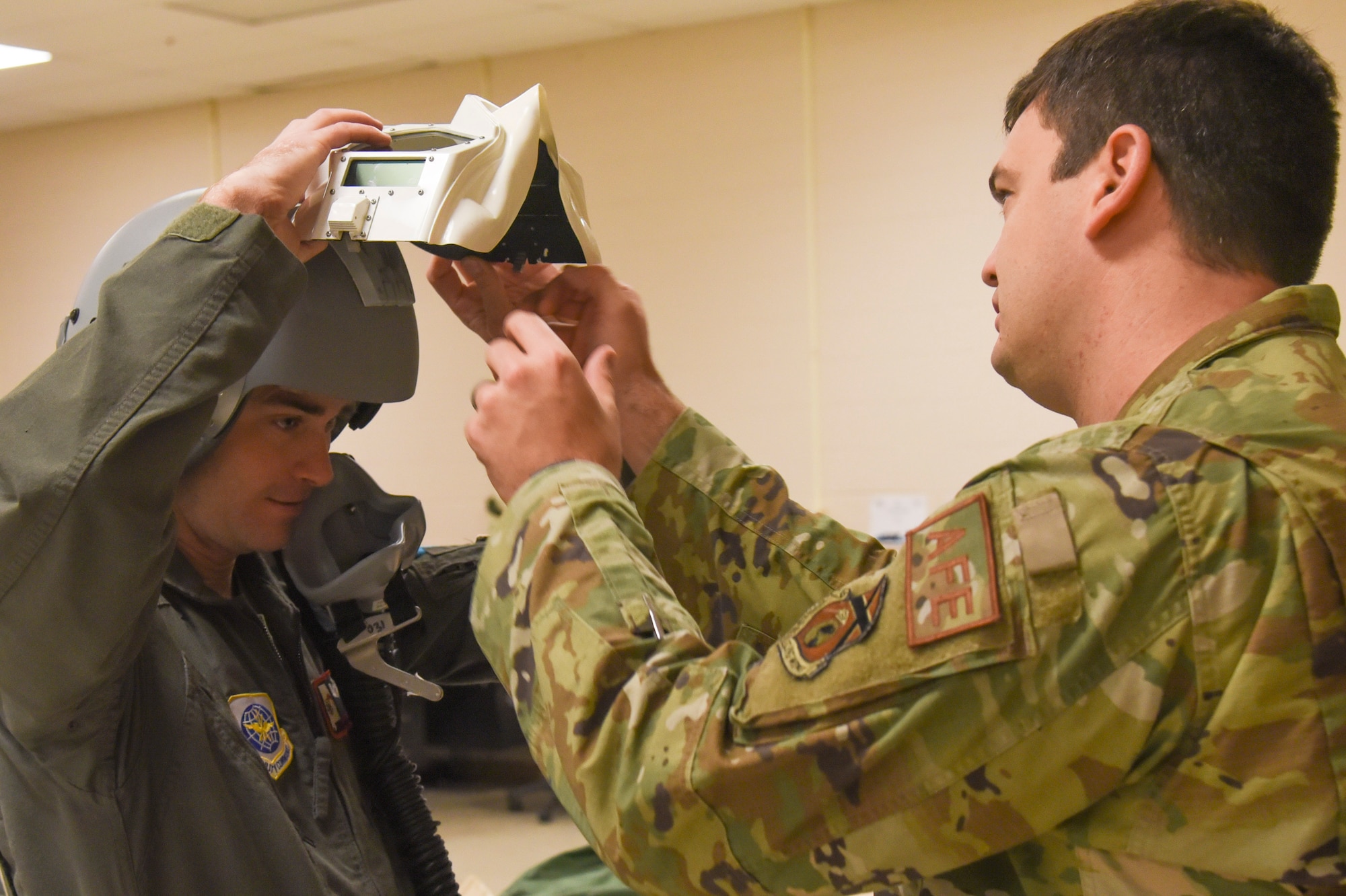 Members of the 117th Aircrew Flight Equipment (AFE) office trains Aircrew on equipment at Sumpter Smith Joint National Guard Base, Alabama, Dec. 2, 2023. The aircrew were training on equipment to shield their eyes in the event of a bright flash. (U.S. Air National Guard photo by Staff Sgt Nicholas Faddis)